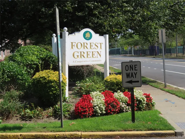 a view of sign board with a yard