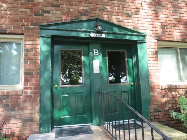a view of a house with a small yard