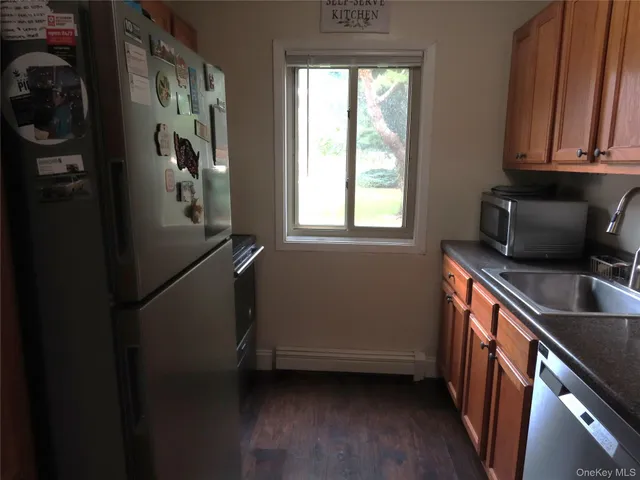 a view of cabinets and wooden floor