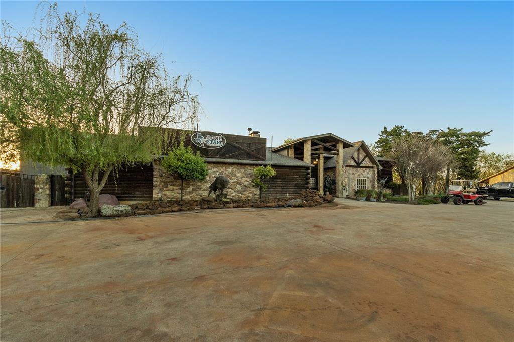 14062 Kempt Drive Pilot Point, TX 76258 - Photo 10 of 11 an outdoor view of a house with a yard and garage