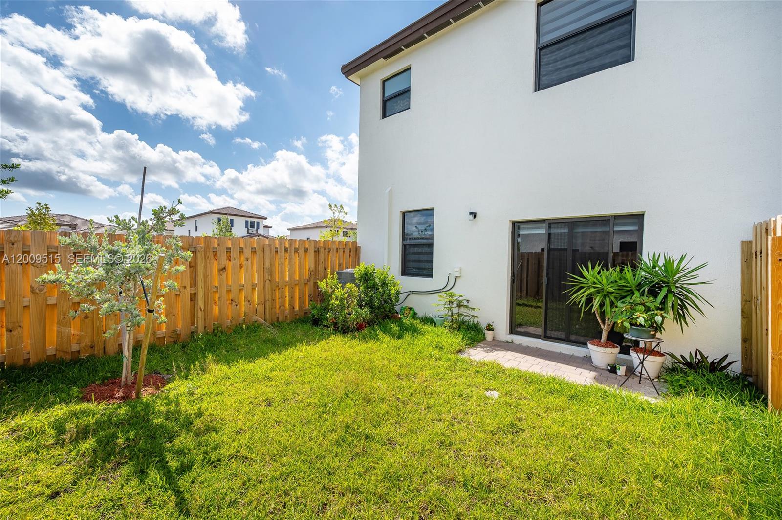 13311 Southwest 233rd Terrace Homestead, FL 33032 - Photo 21 of 21 a view of a backyard with potted plants