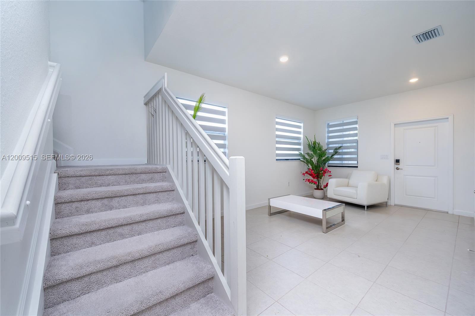 13311 Southwest 233rd Terrace Homestead, FL 33032 - Photo 4 of 21 a view of hall with furniture and stairs