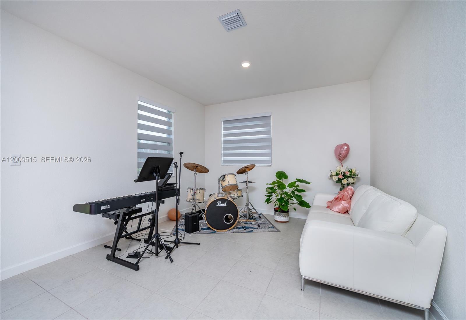 13311 Southwest 233rd Terrace Homestead, FL 33032 - Photo 10 of 21 a living room with furniture and a potted plant