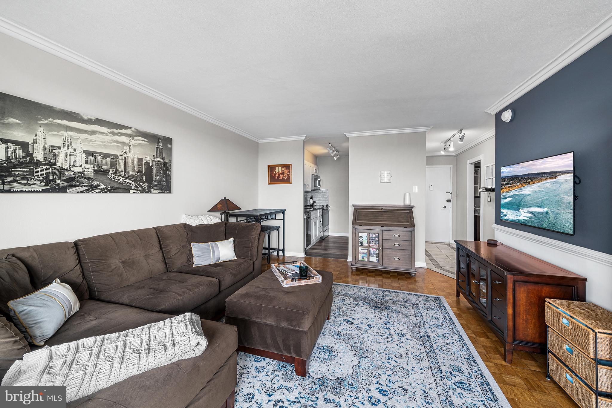 226-30 West Rittenhouse Square, Unit 2308 Philadelphia, PA 19103 - Photo 17 of 30 a living room with furniture and a flat screen tv