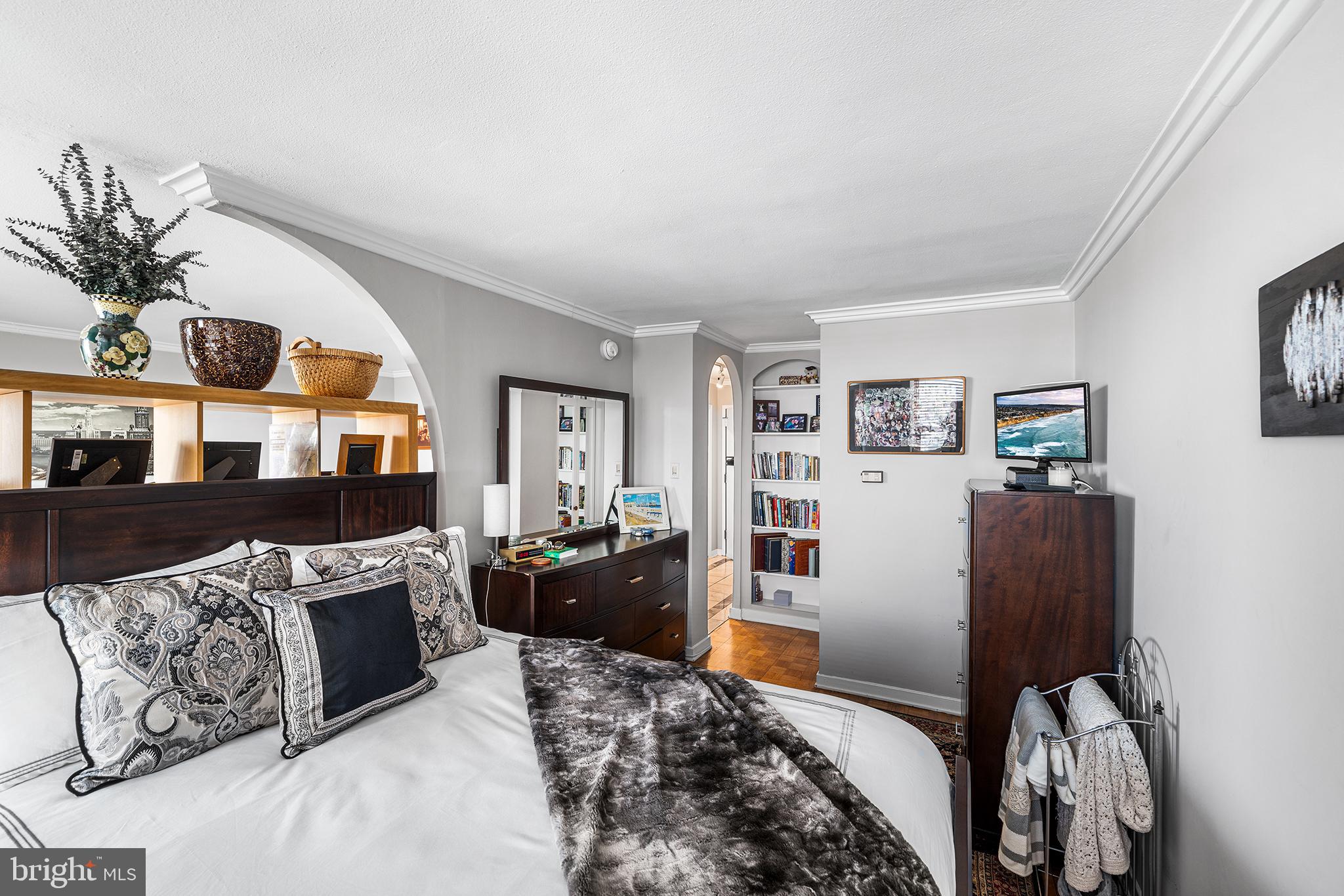 226-30 West Rittenhouse Square, Unit 2308 Philadelphia, PA 19103 - Photo 24 of 30 a bedroom with furniture and a bed