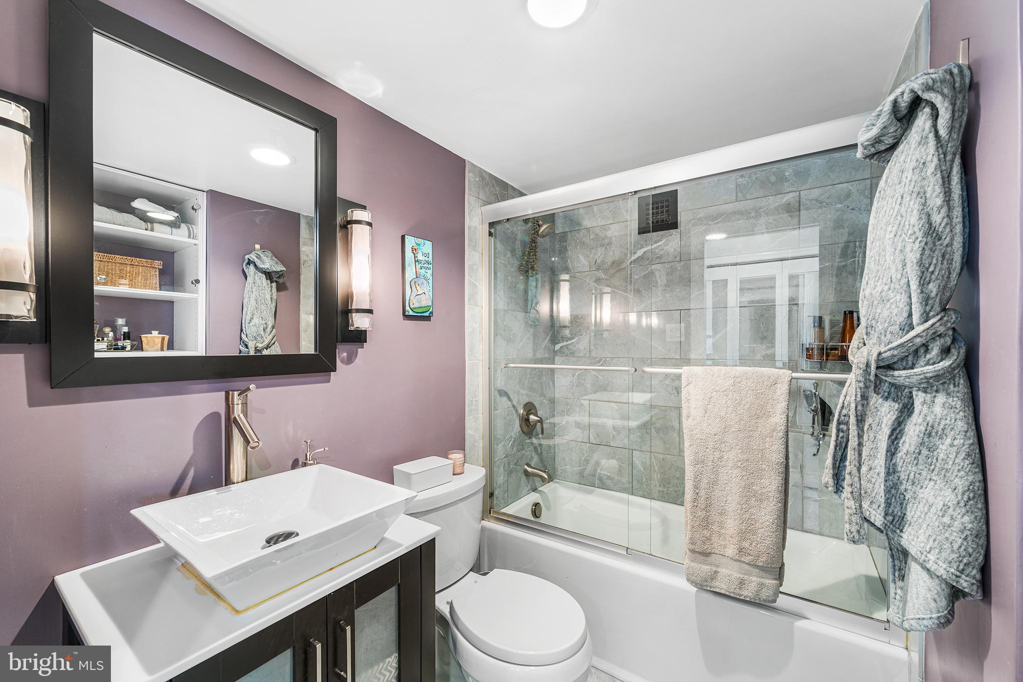 226-30 West Rittenhouse Square, Unit 2308 Philadelphia, PA 19103 - Photo 27 of 30 a bathroom with a toilet a sink and a mirror