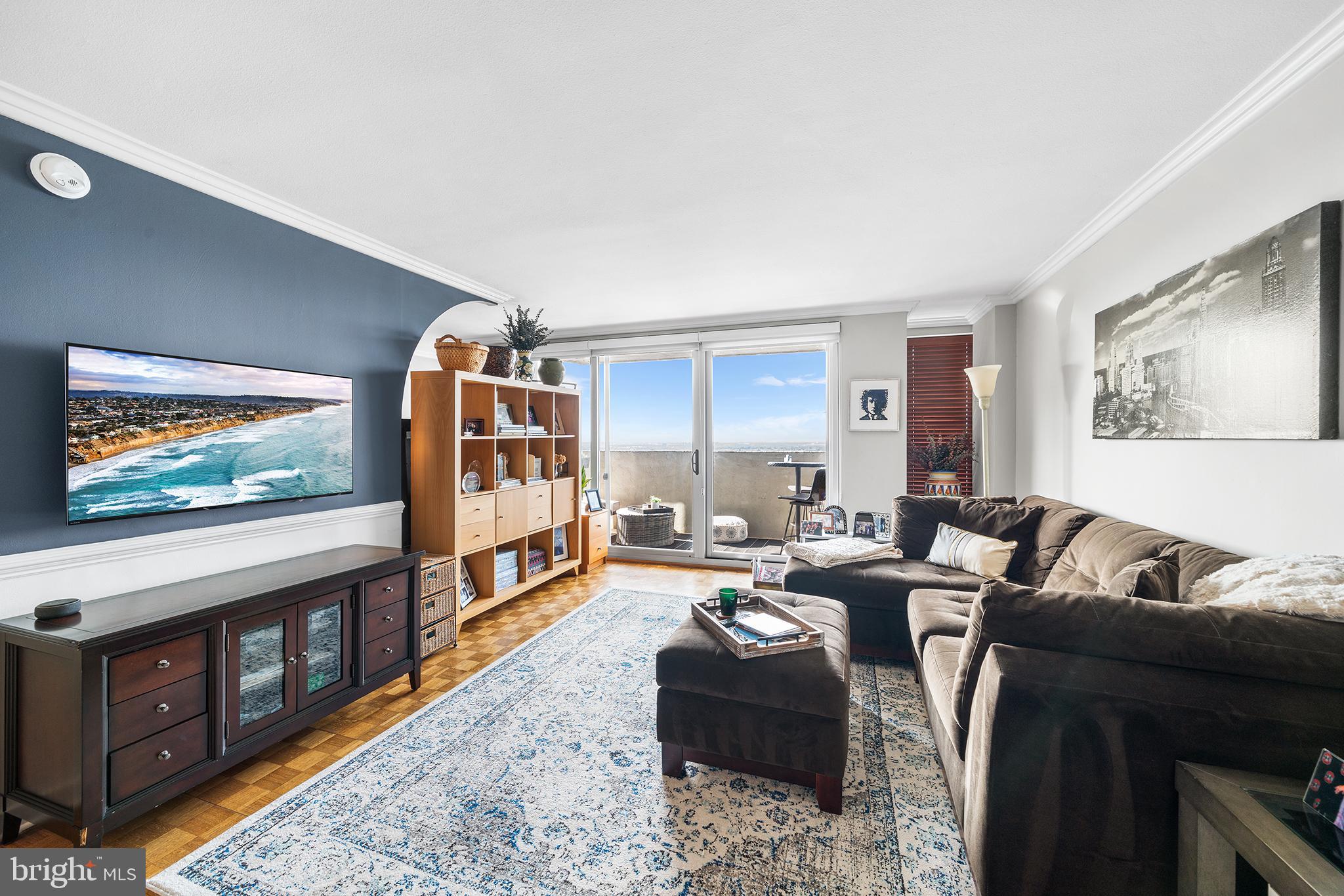 226-30 West Rittenhouse Square, Unit 2308 Philadelphia, PA 19103 - Photo 3 of 30 a living room with furniture and a flat screen tv