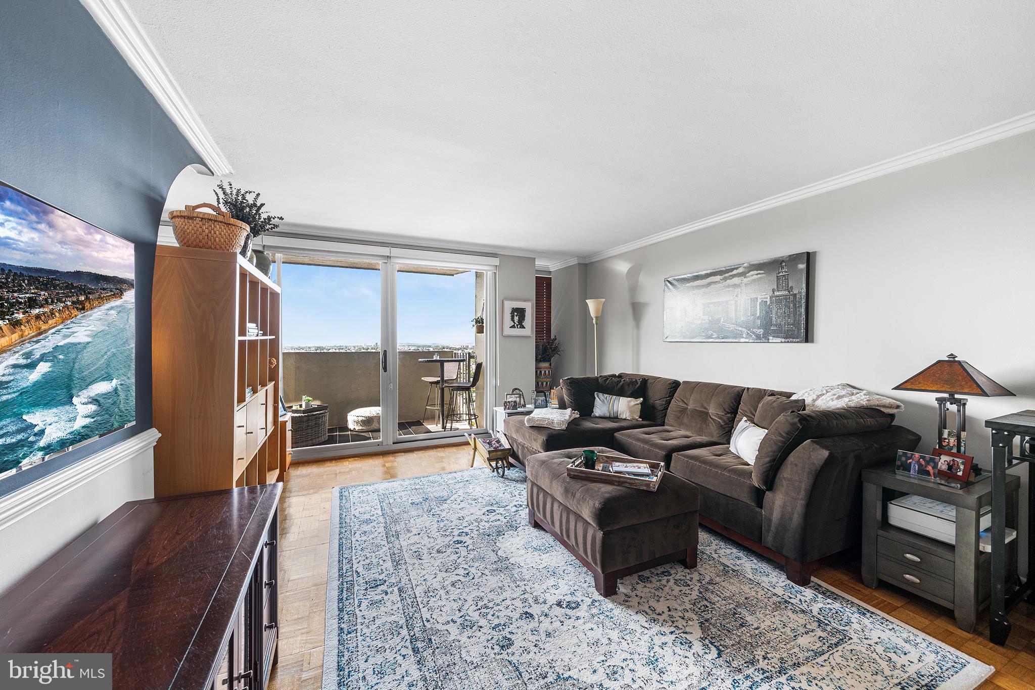 226-30 West Rittenhouse Square, Unit 2308 Philadelphia, PA 19103 - Photo 4 of 30 a living room with furniture and a flat screen tv