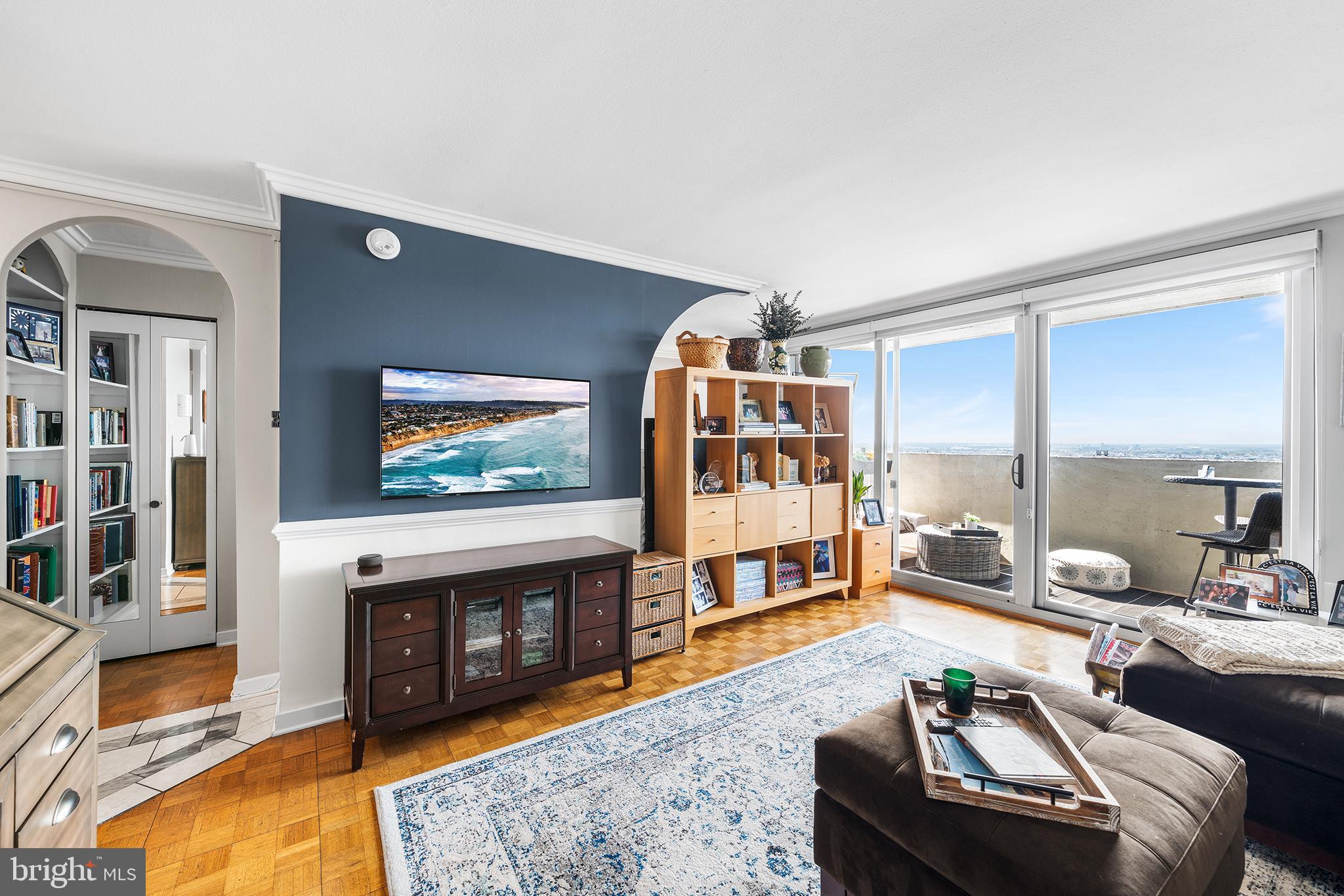 226-30 West Rittenhouse Square, Unit 2308 Philadelphia, PA 19103 - Photo 5 of 30 a living room with furniture and a fireplace