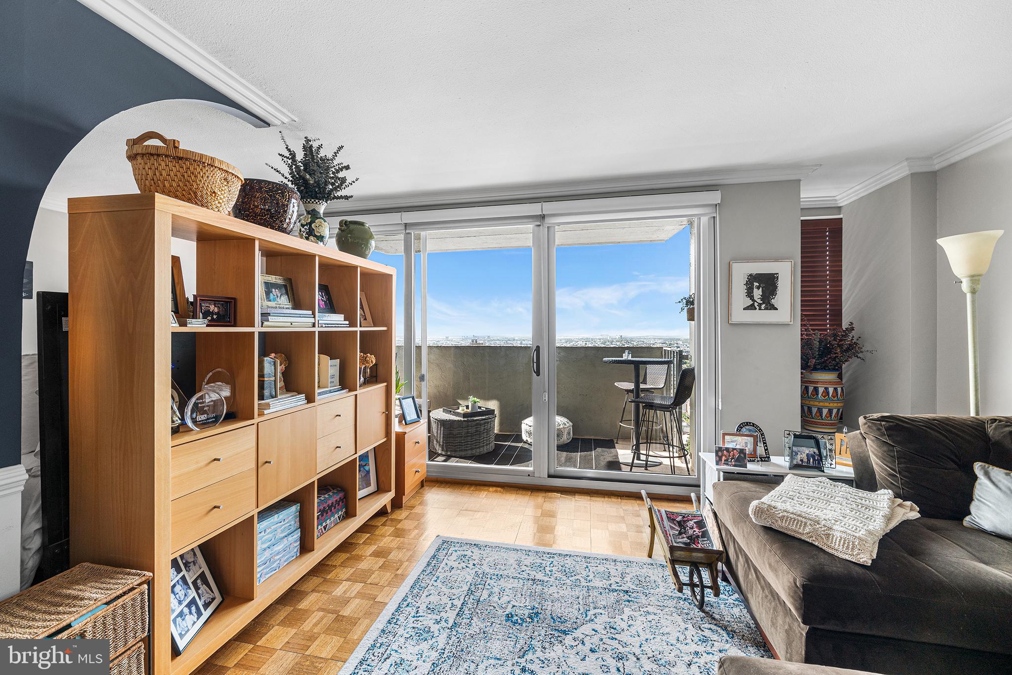 226-30 West Rittenhouse Square, Unit 2308 Philadelphia, PA 19103 - Photo 7 of 30 a living room with furniture and a large window
