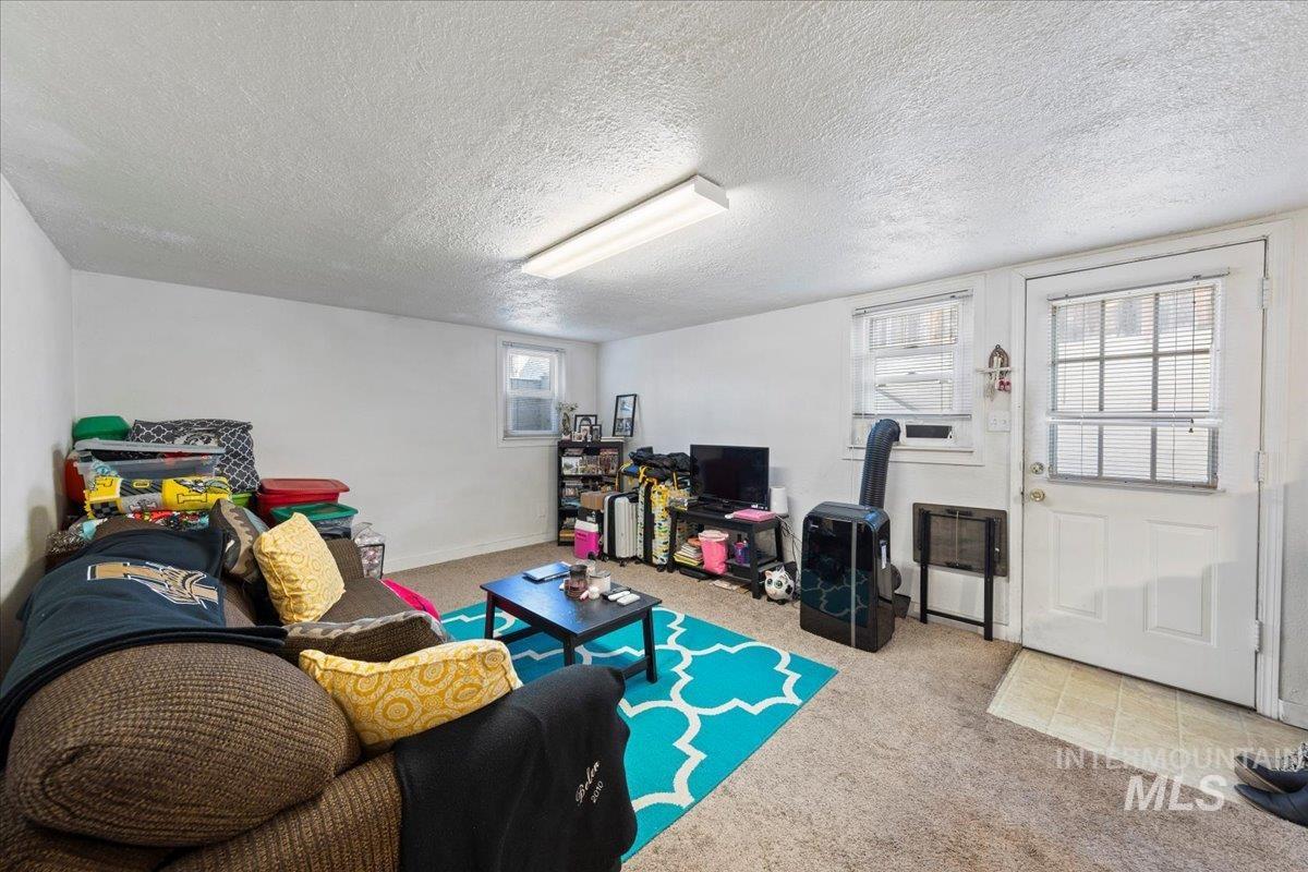 2209 West Idaho Street Boise, ID 83702 - Photo 32 of 42 Living area with carpet flooring
