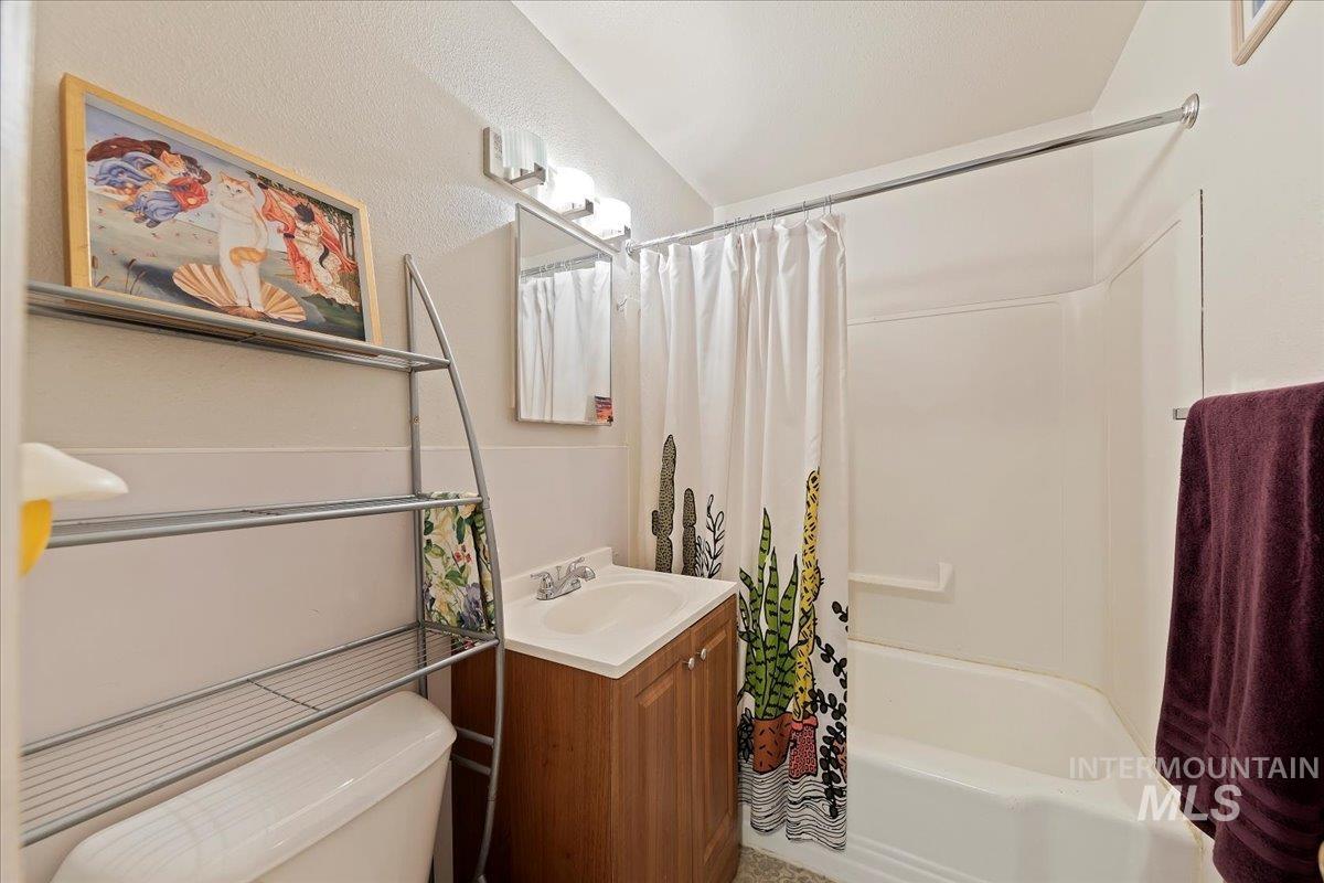 2209 West Idaho Street Boise, ID 83702 - Photo 9 of 42 Bathroom with vanity and shower / bathtub combination with curtain