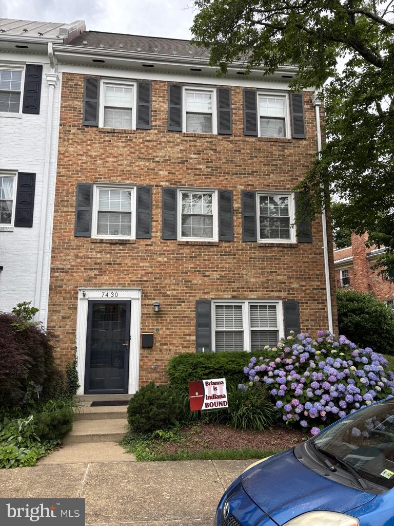 7430 Hallcrest Drive McLean, VA 22102 - Photo 1 of 7 a front view of a house with garden