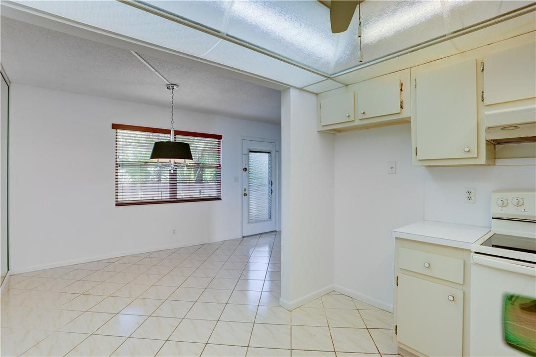 1903 Bermuda Circle, Unit E2 Coconut Creek, FL 33066 - Photo 12 of 25 a view of cabinets and window
