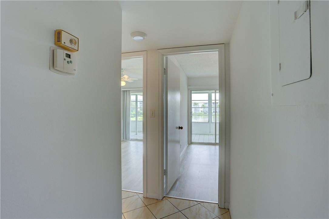 1903 Bermuda Circle, Unit E2 Coconut Creek, FL 33066 - Photo 13 of 25 a view of a bathroom with mirror