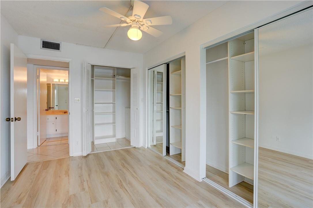 1903 Bermuda Circle, Unit E2 Coconut Creek, FL 33066 - Photo 21 of 25 wooden floor in an empty room with a window