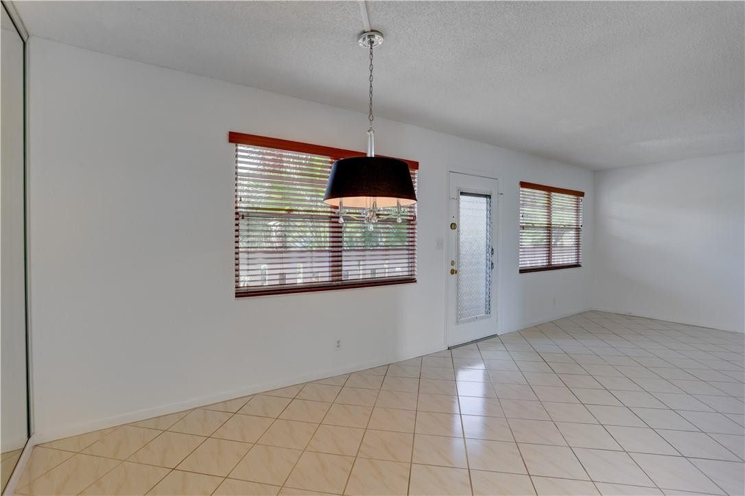 1903 Bermuda Circle, Unit E2 Coconut Creek, FL 33066 - Photo 3 of 25 a view of a room that has a window in it