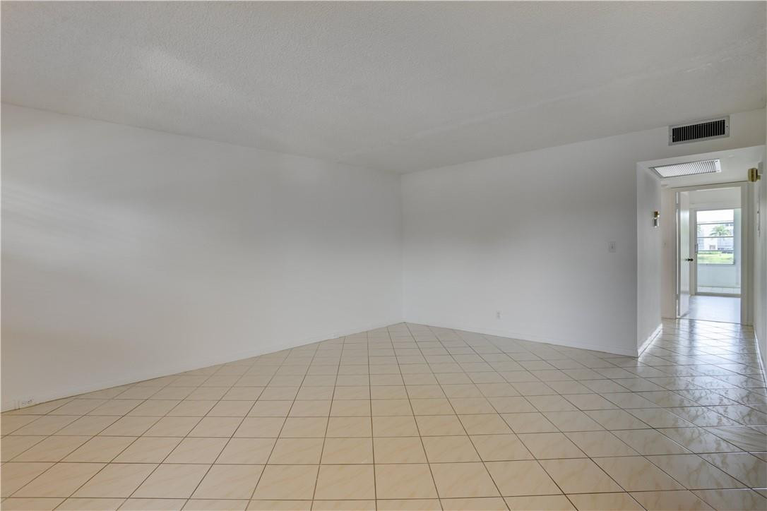 1903 Bermuda Circle, Unit E2 Coconut Creek, FL 33066 - Photo 6 of 25 a view of an empty room and window