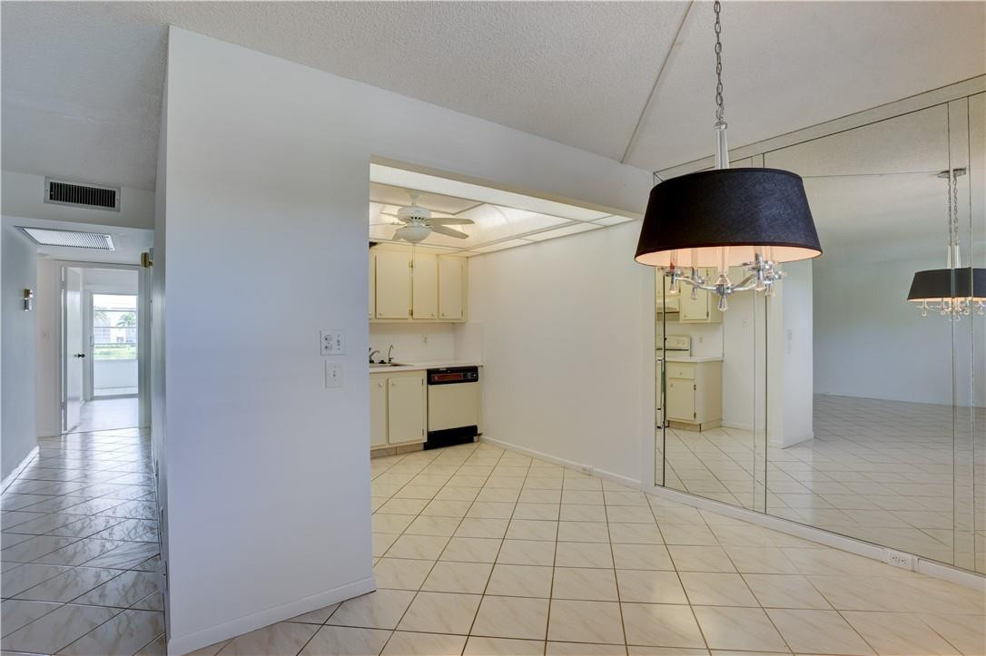 1903 Bermuda Circle, Unit E2 Coconut Creek, FL 33066 - Photo 8 of 25 a view of a kitchen with a sink and cabinets