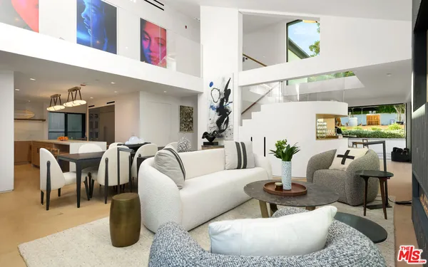 a kitchen with stainless steel appliances a stove a cabinets and wooden floor