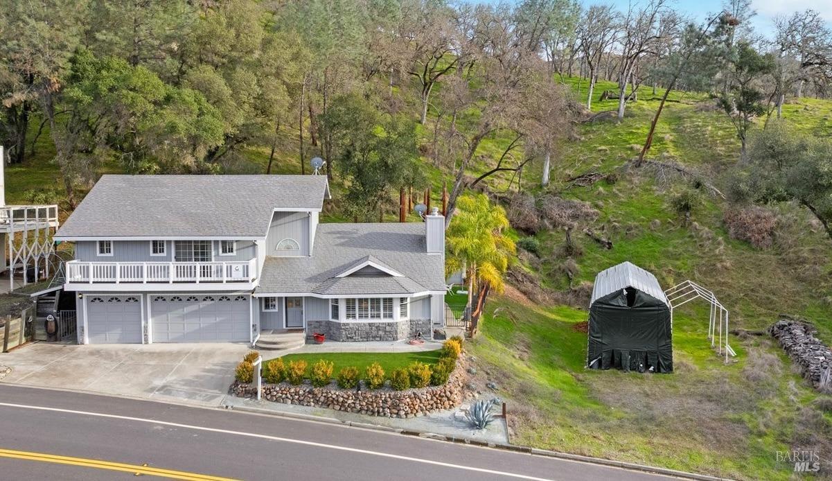 an aerial view of a house with a garden