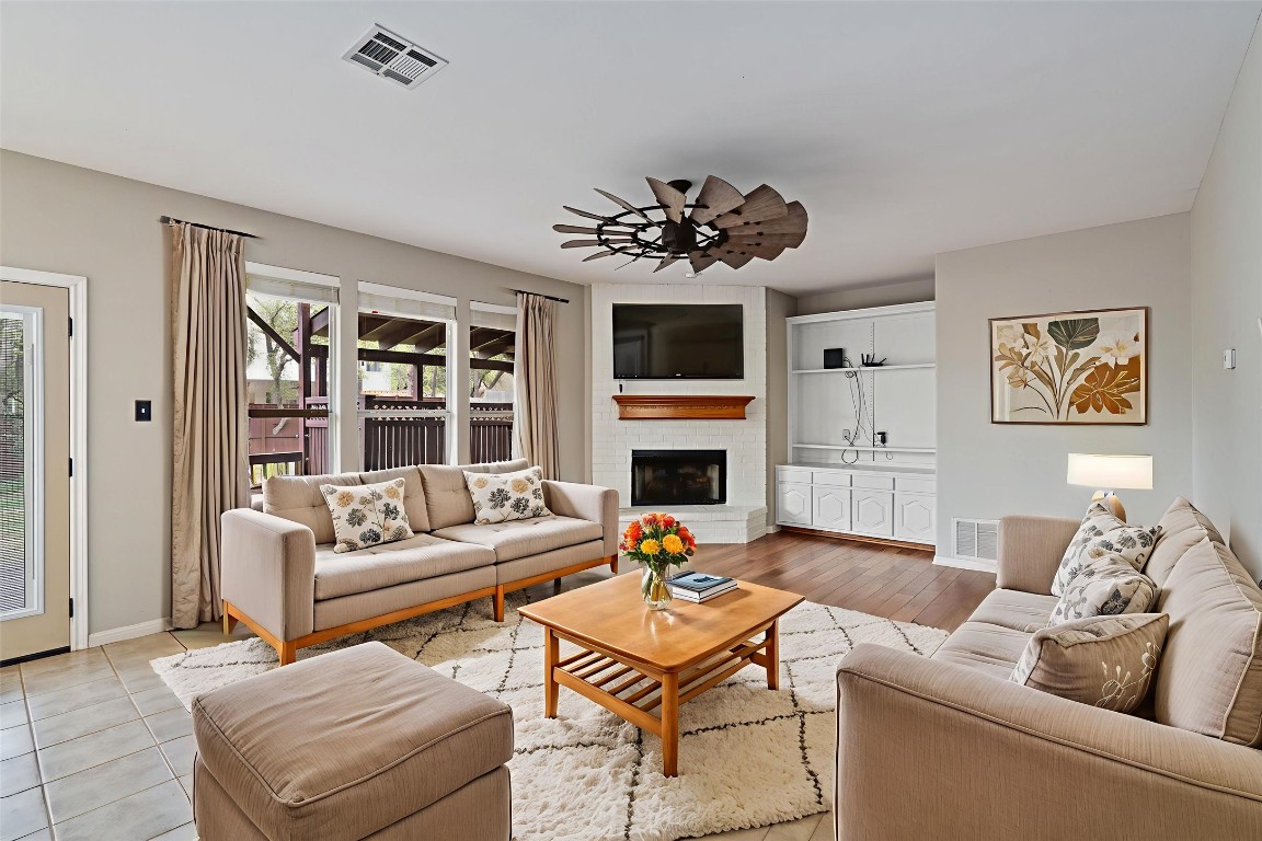 318 Ridge Run Drive Georgetown, TX 78628 - Photo 4 of 39 The living room is in the back of the home and the perfect space to relax! Enjoy a book by the fire place or step out onto the extended patio! (virtually staged)