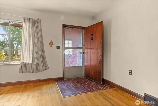 a view of an empty room and window
