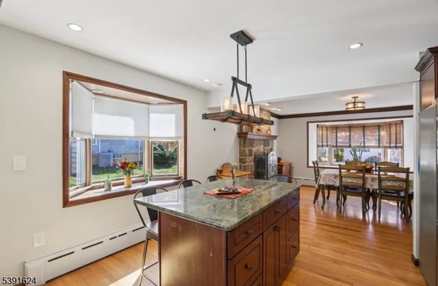 a kitchen with stainless steel appliances granite countertop a stove and refrigerator