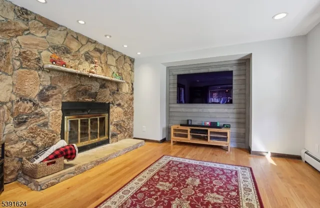a bedroom with furniture and a fireplace
