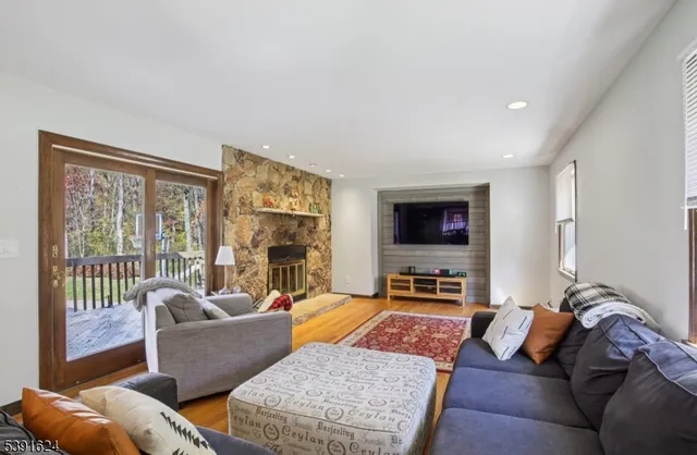 a living room with furniture or couch and a flat screen tv