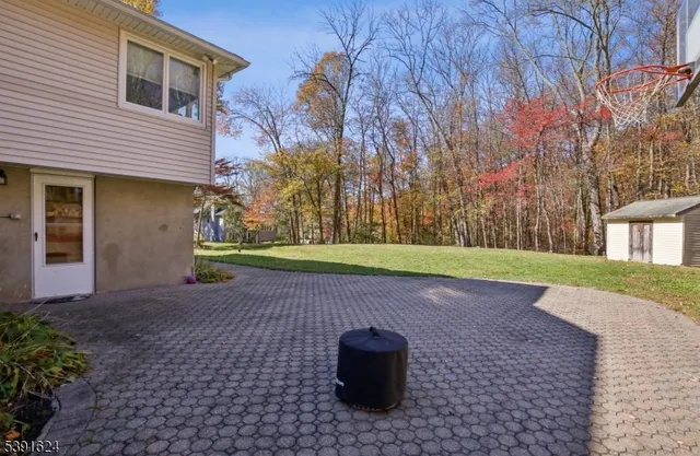 a view of backyard with entertaining space