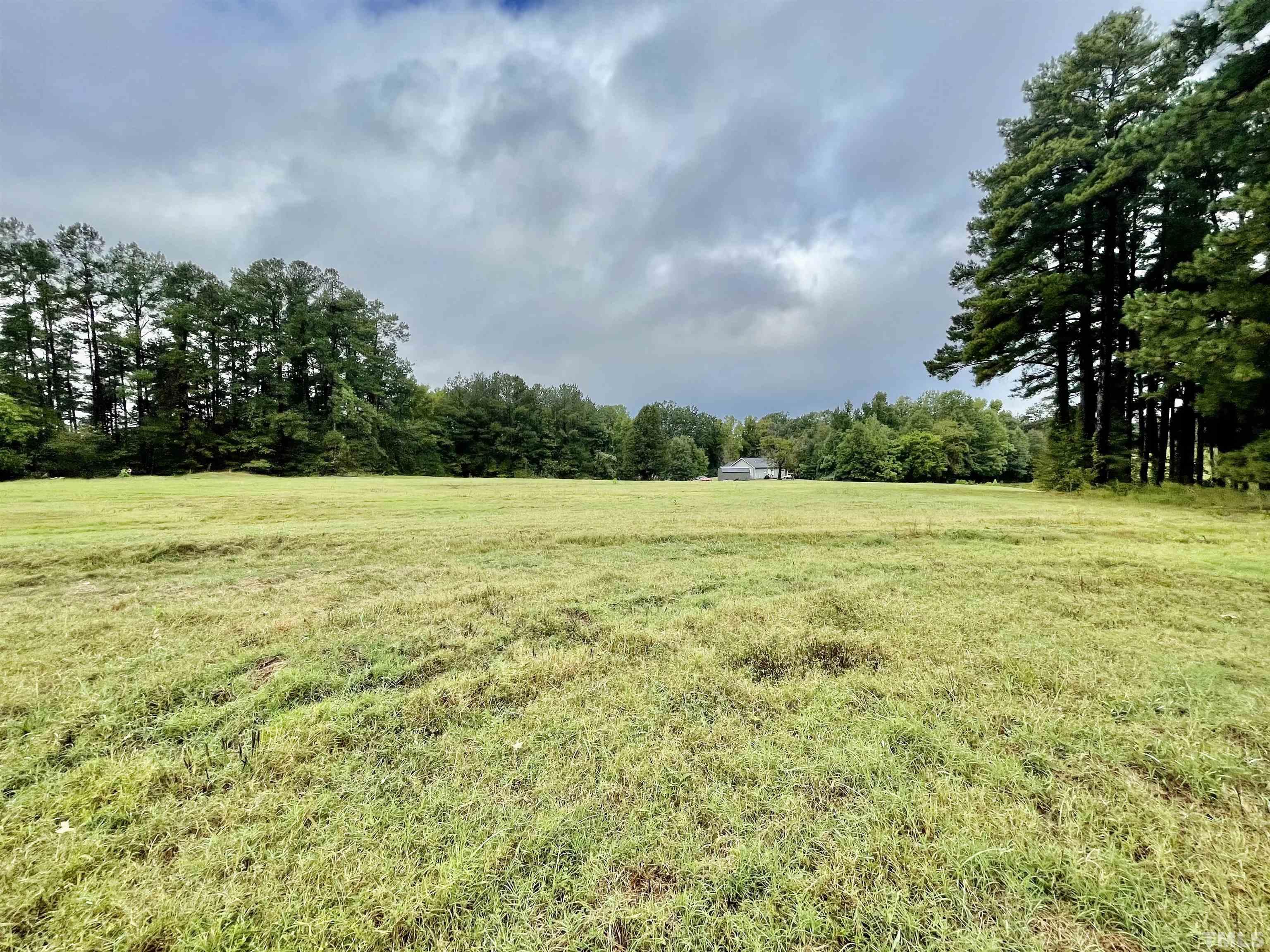 Lot 9 Chub Lake Road Roxboro, NC 27574 - Photo 7 of 9 a view of a garden with a house