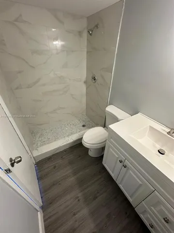 a bathroom with a sink and toilet