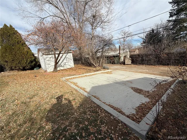 a view of a yard with snow on the road