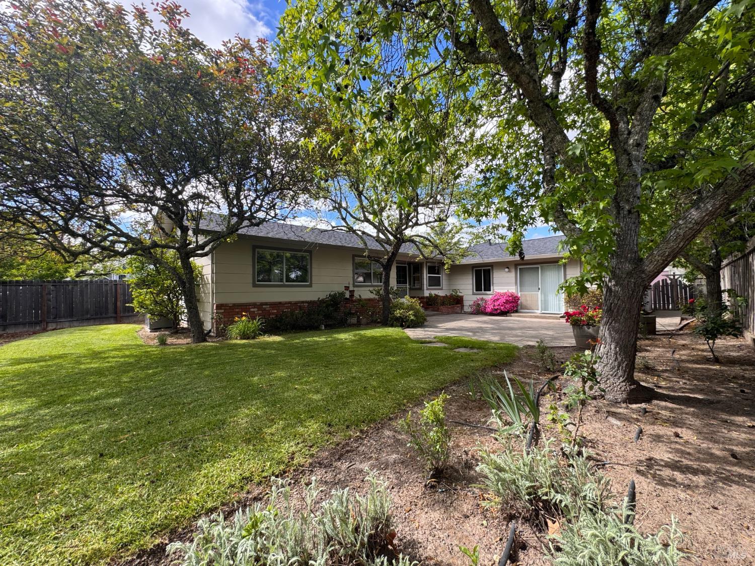 135 Fulton Place Windsor, CA 95492 - Photo 4 of 41 a front view of a house with garden