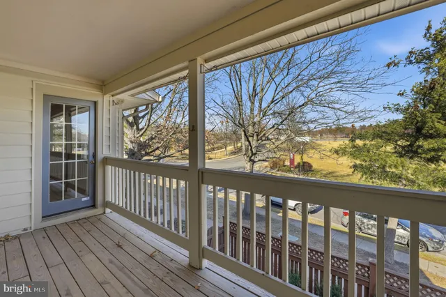 a view of a wooden balcony with outdoor space