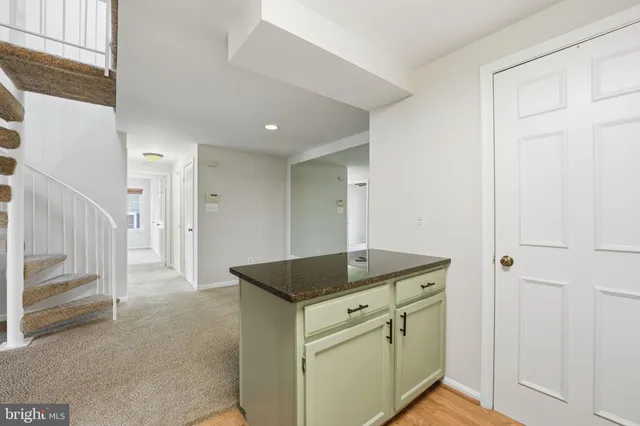 a utility room with cabinets