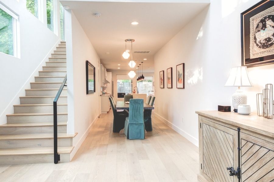 916 East 50th Street, Unit 1 Austin, TX 78751 - Photo 27 of 36 Soaring ceilings and a wall of oversized windows create a grand, light-filled entry. CLICK VIRTUAL TOUR FOR FLOOR PLAN AND 3D WALK THROUGH!