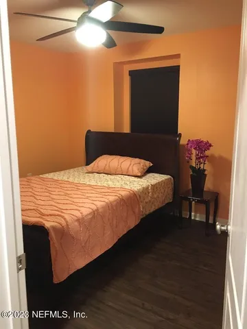 a bedroom with a bed and a cabinet