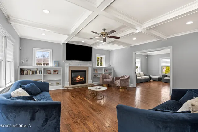 a kitchen with granite countertop white cabinets and a stove