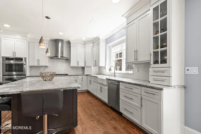a large bed sitting in a bedroom next to a window