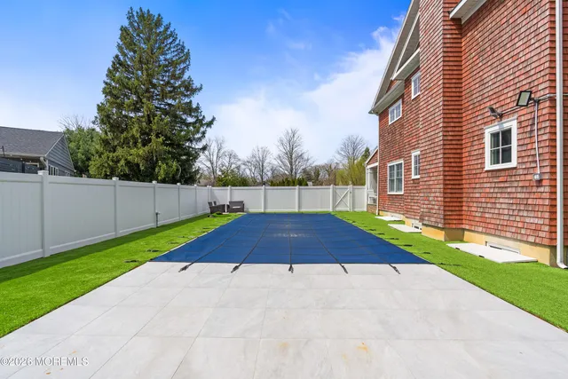 a view of a hallway view with wooden floor and staircase