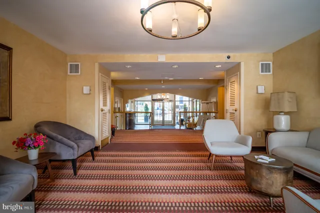 a view of a lobby with furniture and floor to ceiling window