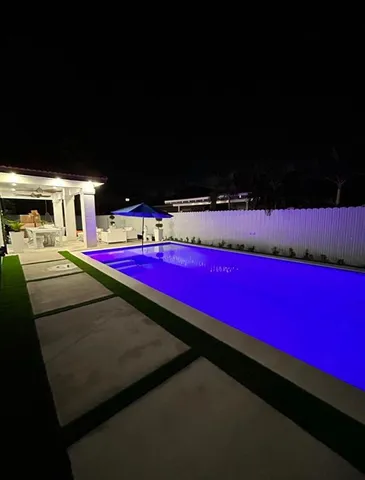 a white car parked in front of a building