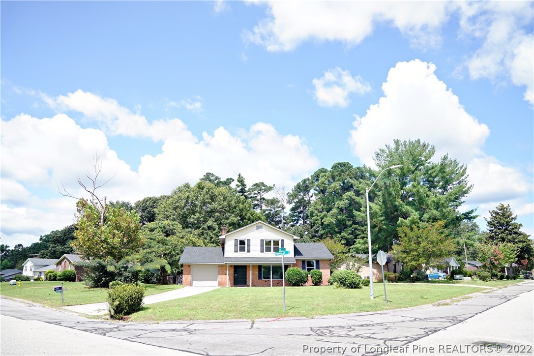 197 Paddle Wheel Road Fayetteville, NC 28314 - Photo 1 of 39 a front view of a house with a yard and garage