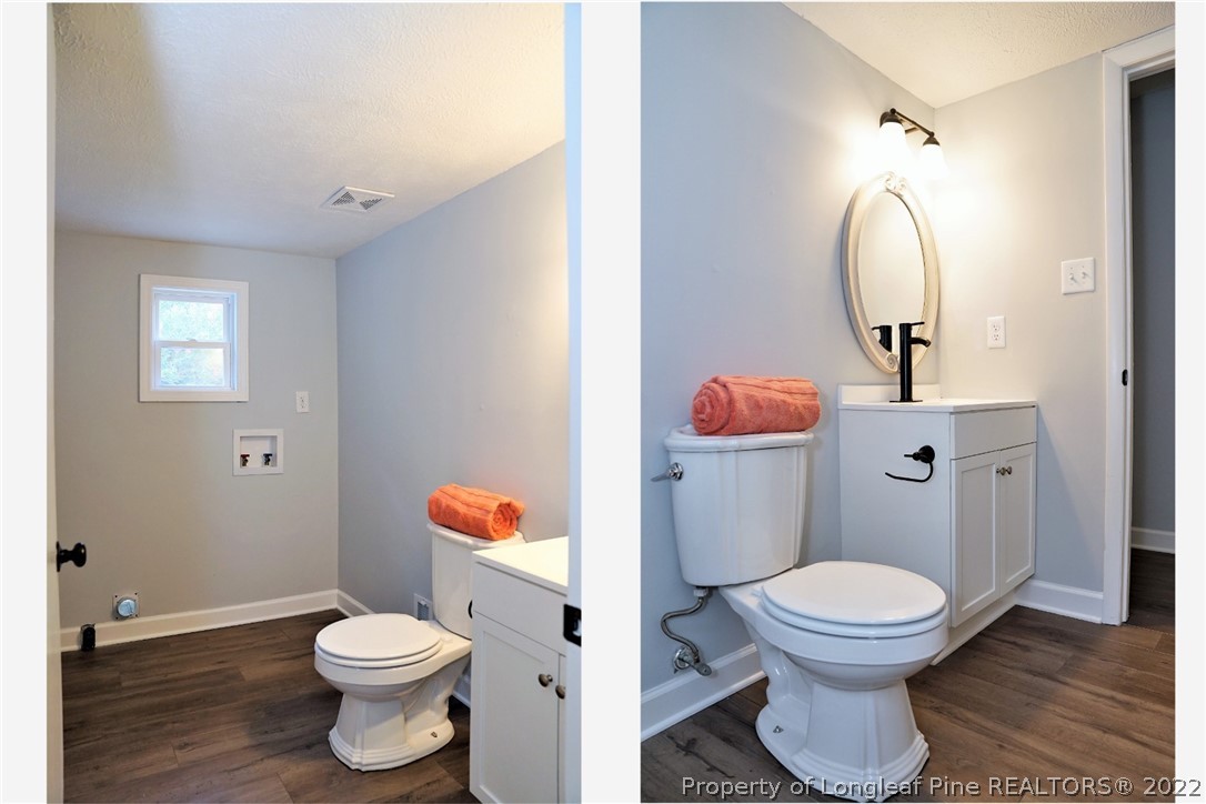 197 Paddle Wheel Road Fayetteville, NC 28314 - Photo 19 of 39 a bathroom with a toilet sink vanity and mirror
