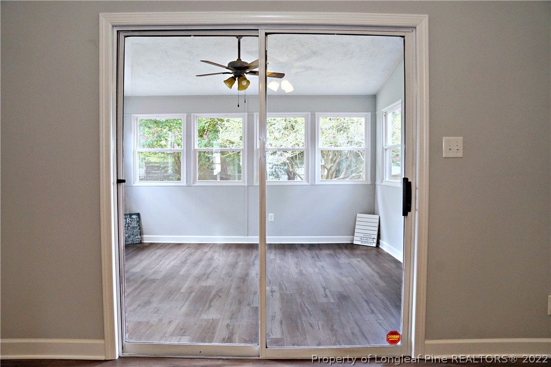 197 Paddle Wheel Road Fayetteville, NC 28314 - Photo 23 of 39 a view of an empty room with a window and wooden floor