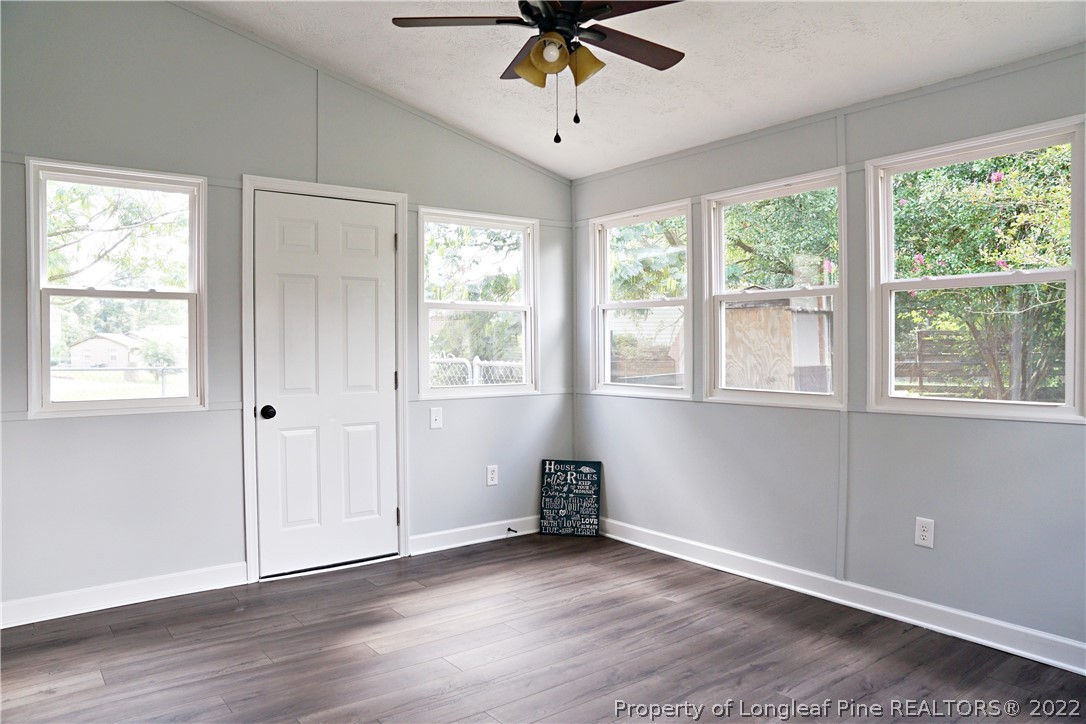 197 Paddle Wheel Road Fayetteville, NC 28314 - Photo 24 of 39 a view of an empty room with a window and wooden floor