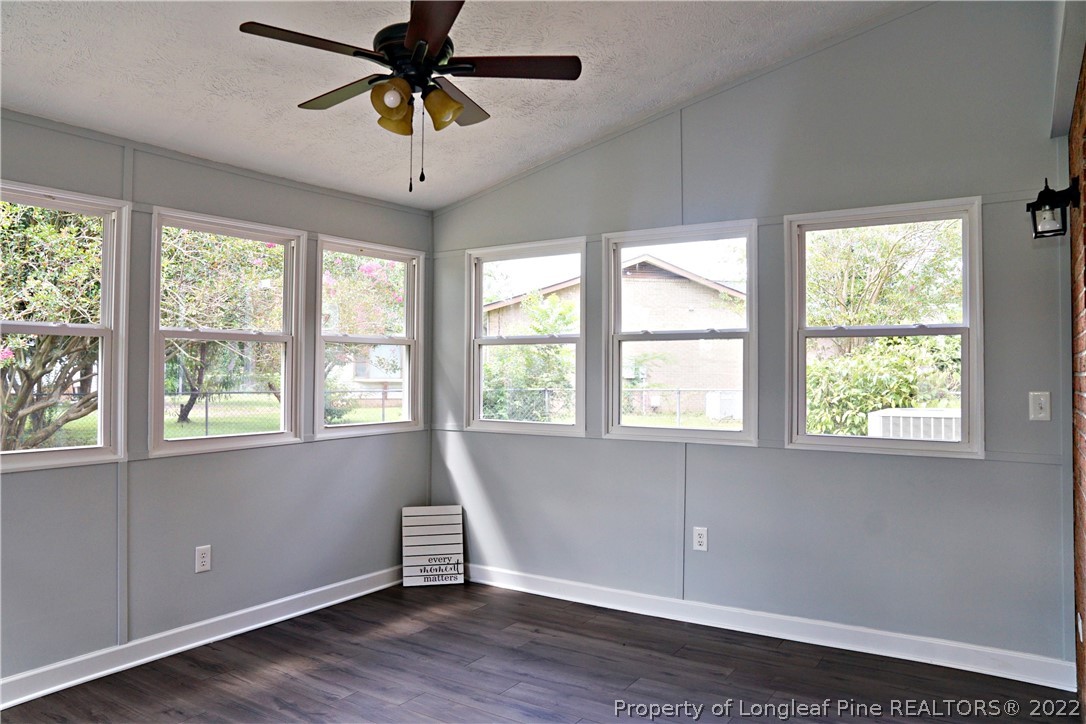 197 Paddle Wheel Road Fayetteville, NC 28314 - Photo 25 of 39 a view of an empty room with a window and wooden floor