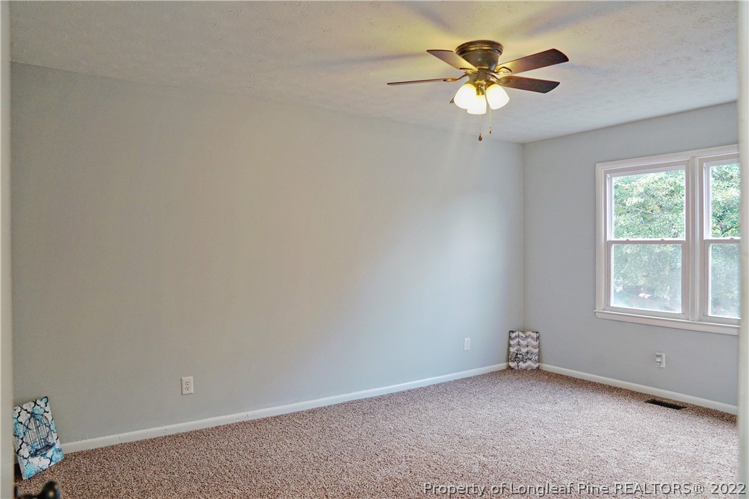 197 Paddle Wheel Road Fayetteville, NC 28314 - Photo 33 of 39 an empty room with a window and a fan